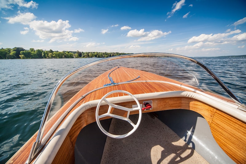 Front end of a motor boat on a lake