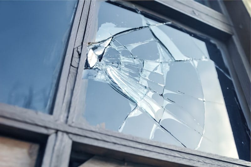 Close-up of window with broken glass.