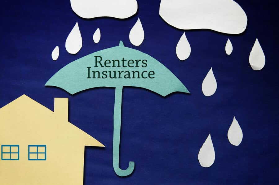 Insurance concept depicting paper rain and clouds with Renters Insurance umbrella protecting a house.